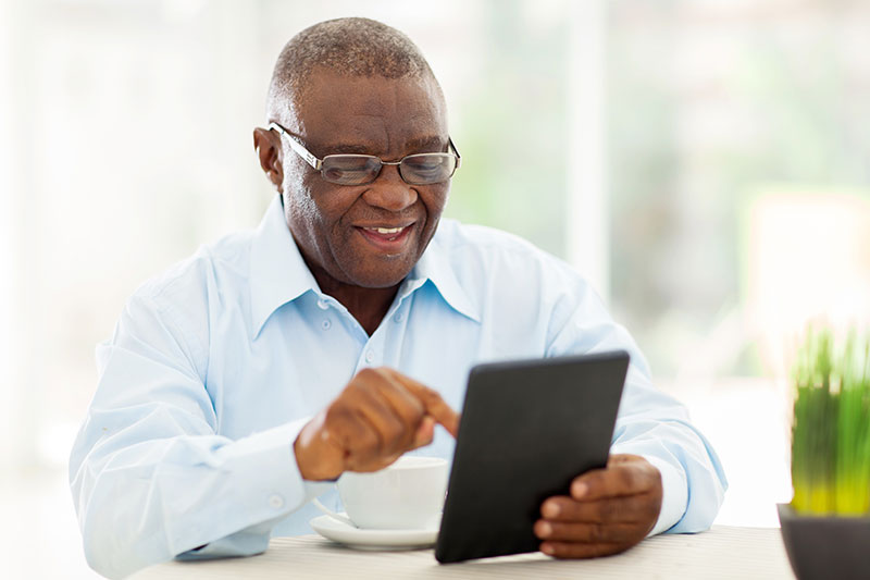 black mature elderly male eyewear on tablet