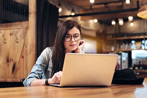 white female on a computer