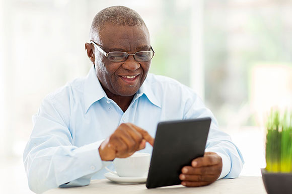 black mature elderly male eyewear on tablet